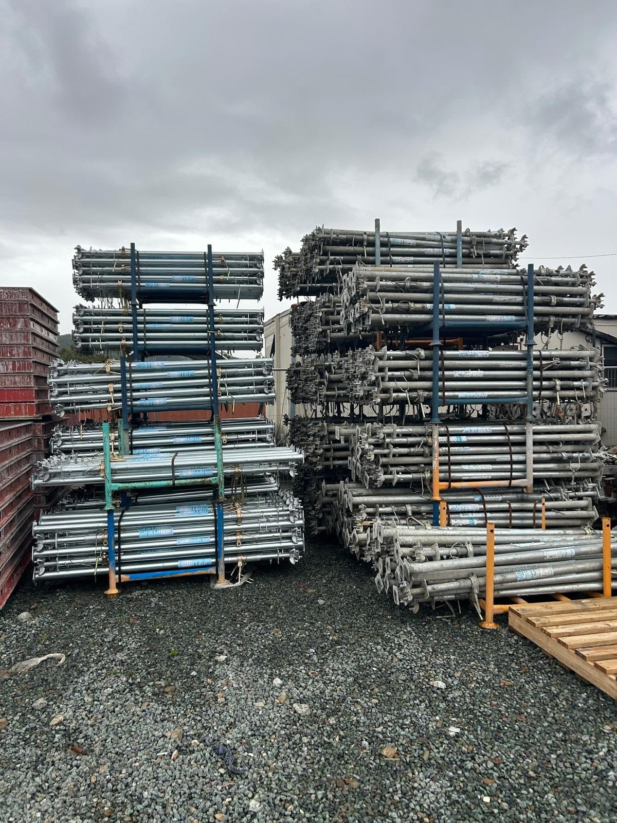 Props and frames racked in the yard, stacked several bays deep