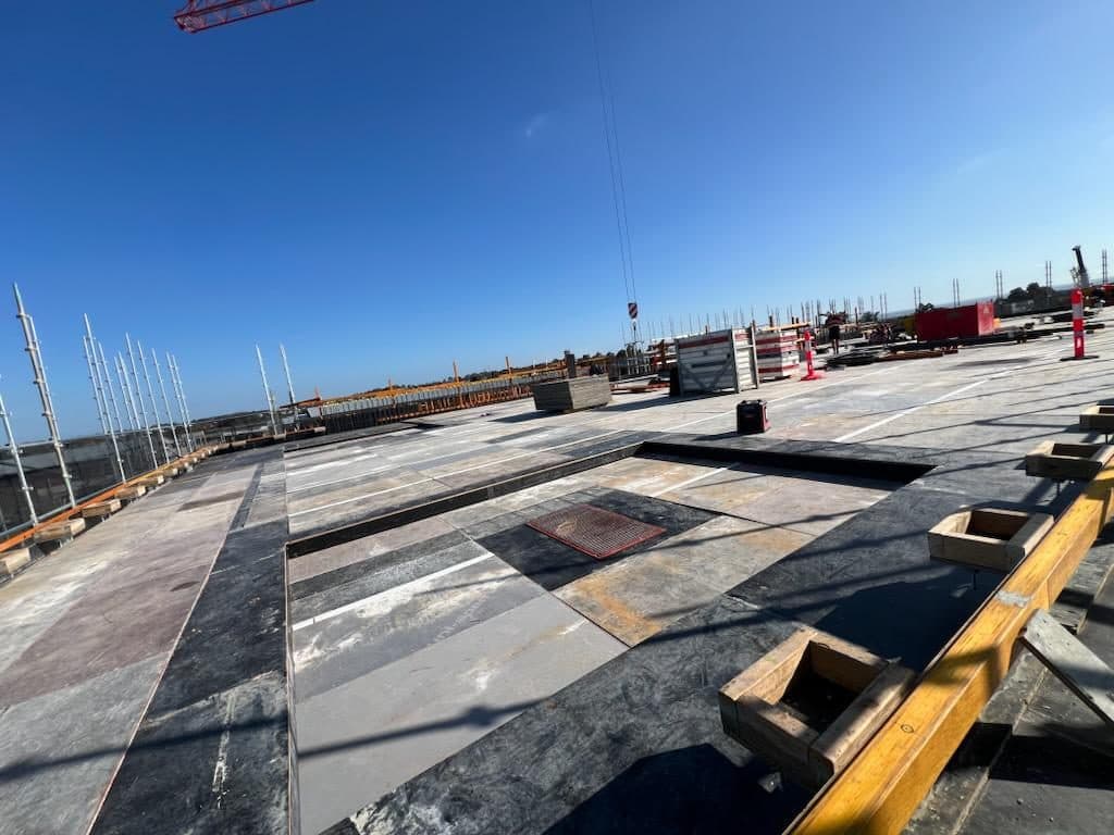 A supreme deck seen from above, panels laid out across the pour area